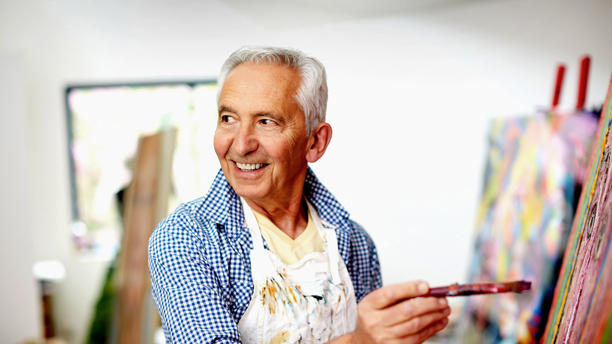 assisted living resident enjoying painting activities at Varenita of Simi Valley retirement community