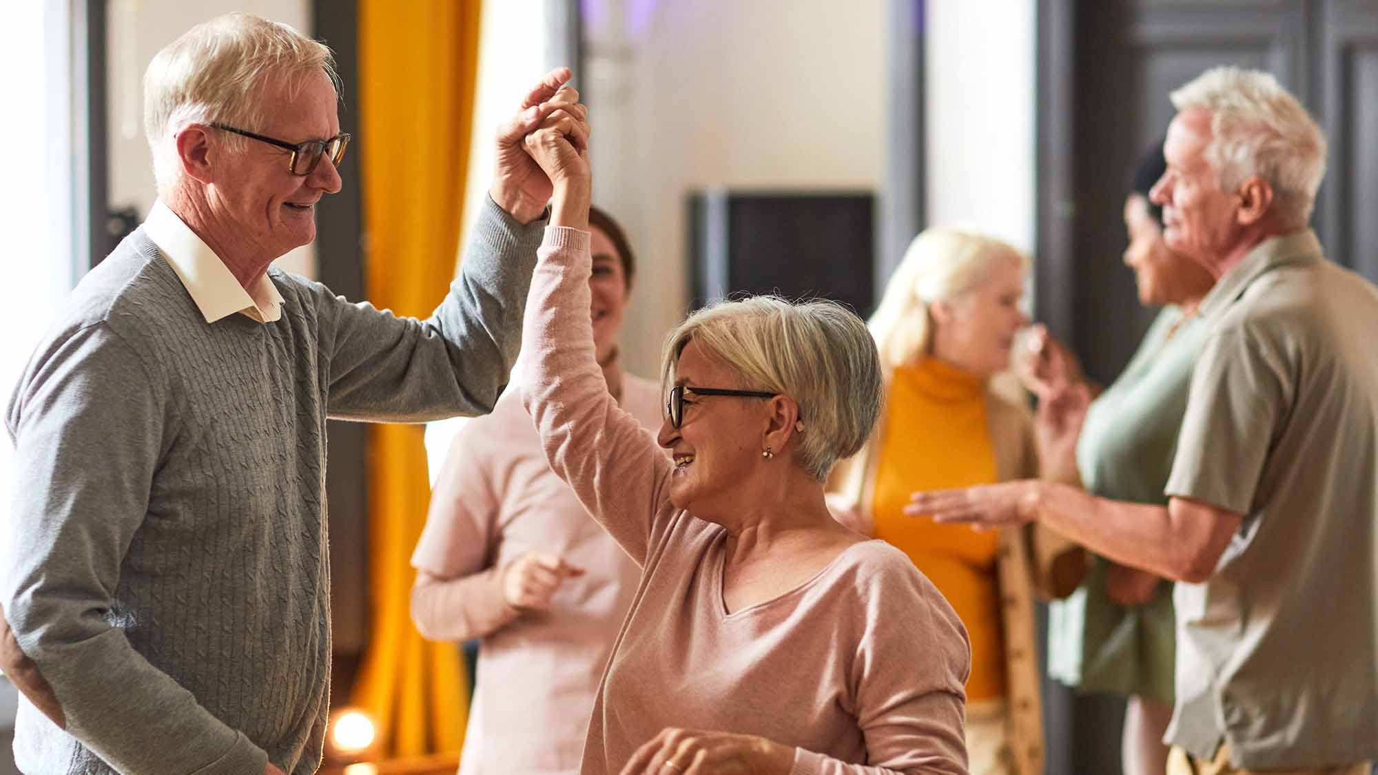 Senior living community residents dancing