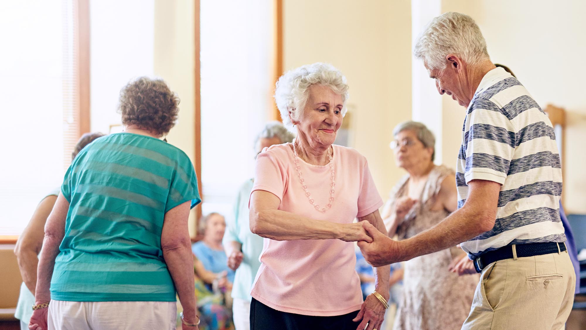 memory care residents dancing together