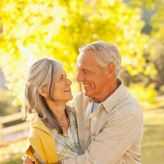 happy elderly couple outside