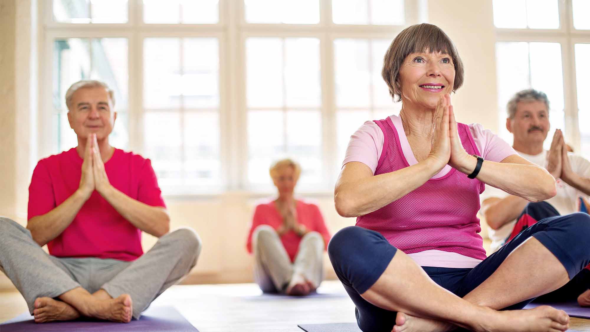 Senior living community residents taking Yoga Classes