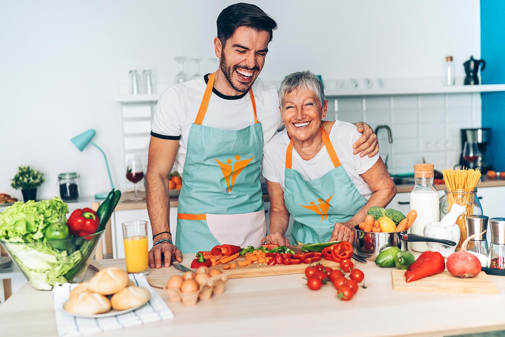 Senior Mon and son having a good time in the Varenita kitchen