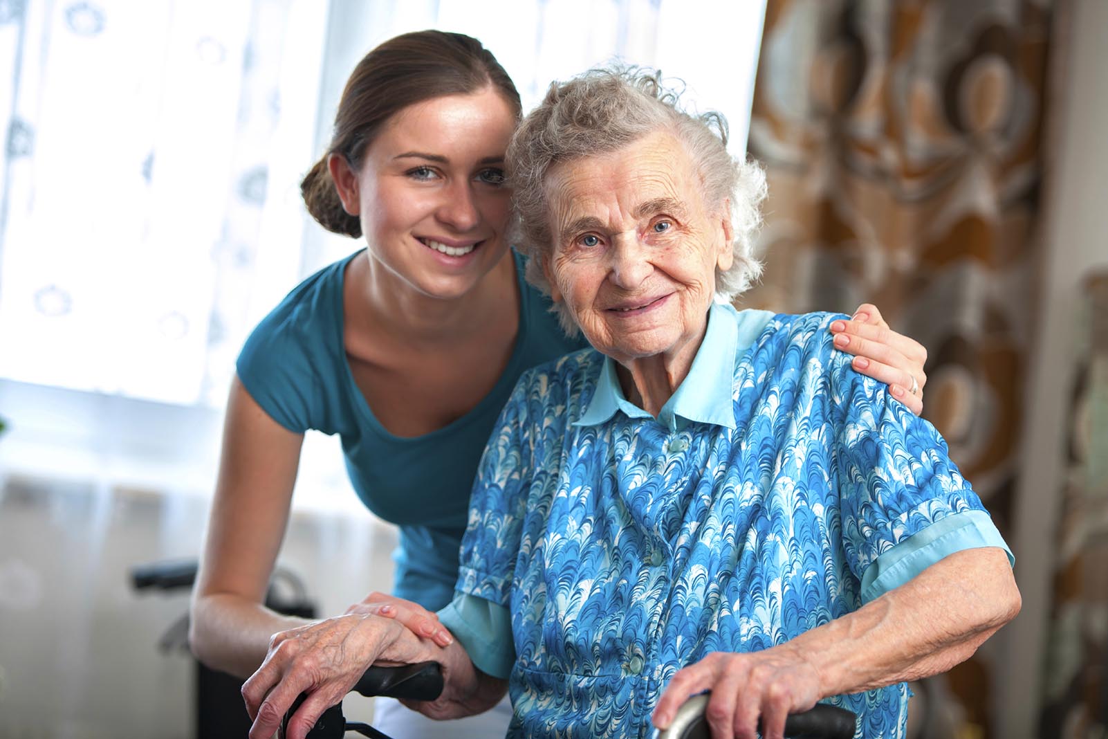 Senior woman in memory care with her caregiver