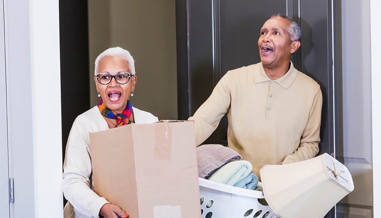 senior couple moving into a retirement community