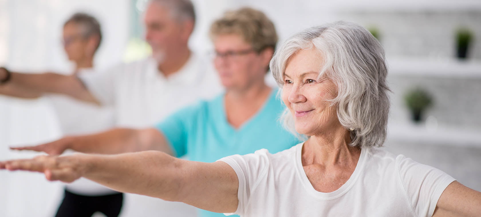 Seniors working out in an exercise class at their senior living community